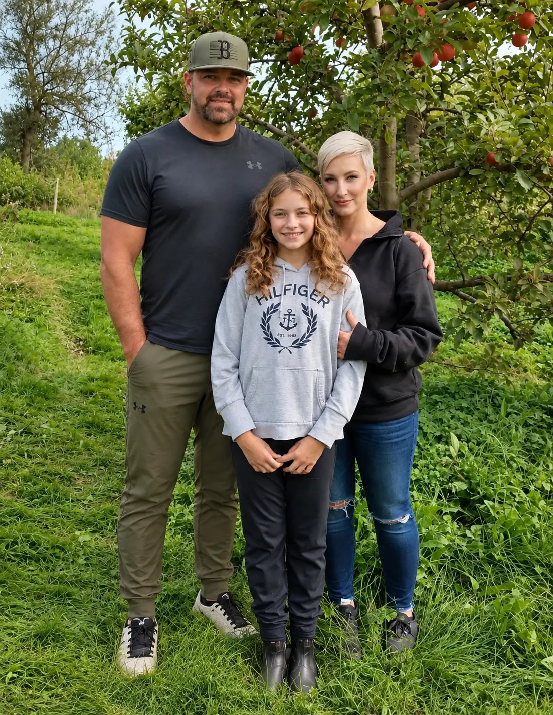 The Veniott family in an apple orchard